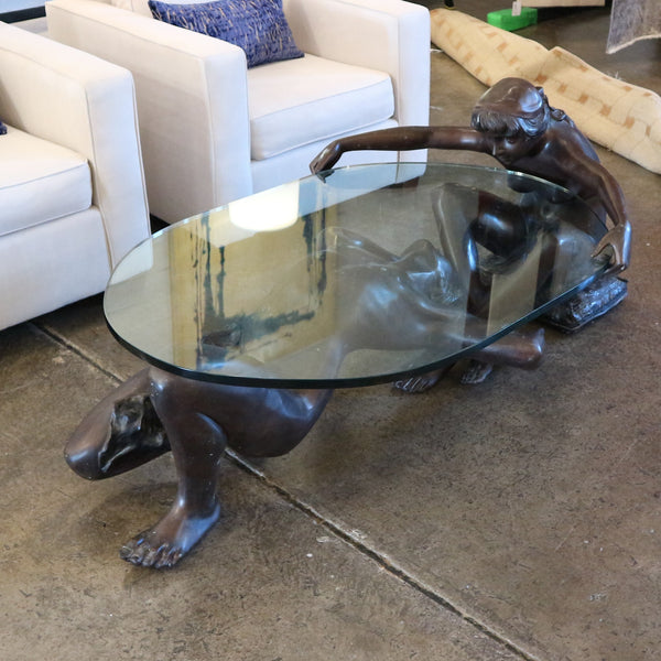 C. Conndray Bronze Couple Holding Glass Coffee Table