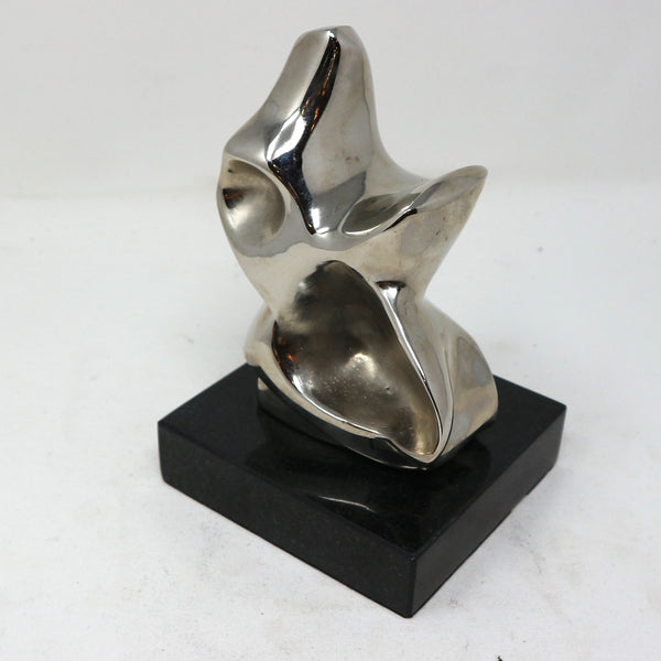 Nickel Abstract Sculpture on Granite