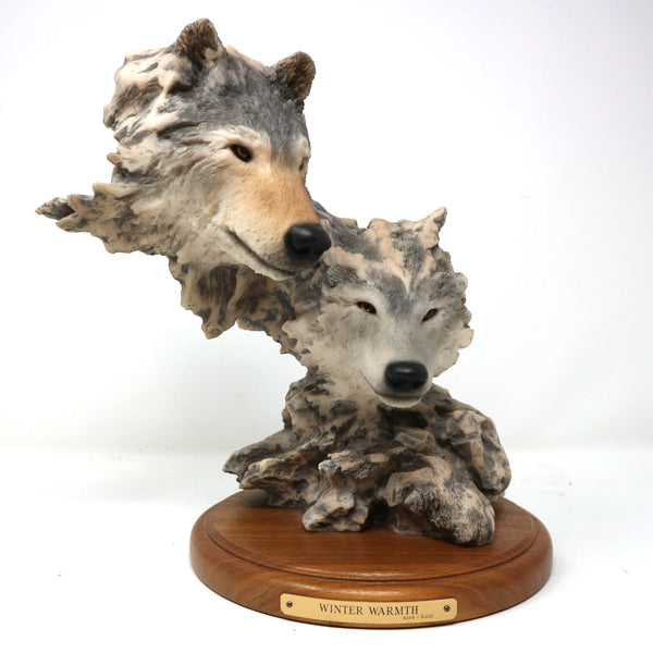 “Winter Warmth” Wolf Sculpture by Randal Raeding